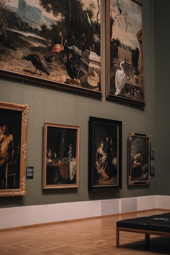 Services Elegant art gallery interior with classic paintings on green walls in Munich, Germany.